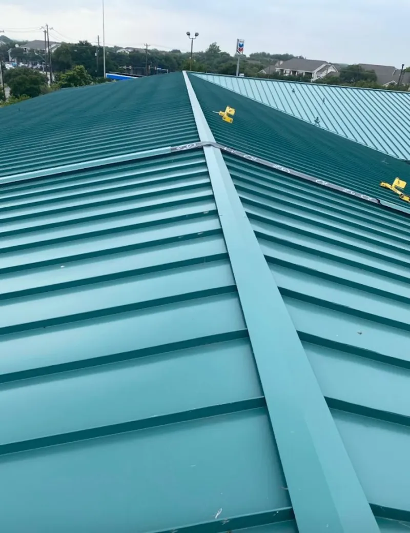 Green commercial metal roof ridge and valley for Metal Roof Repair in Forsyth